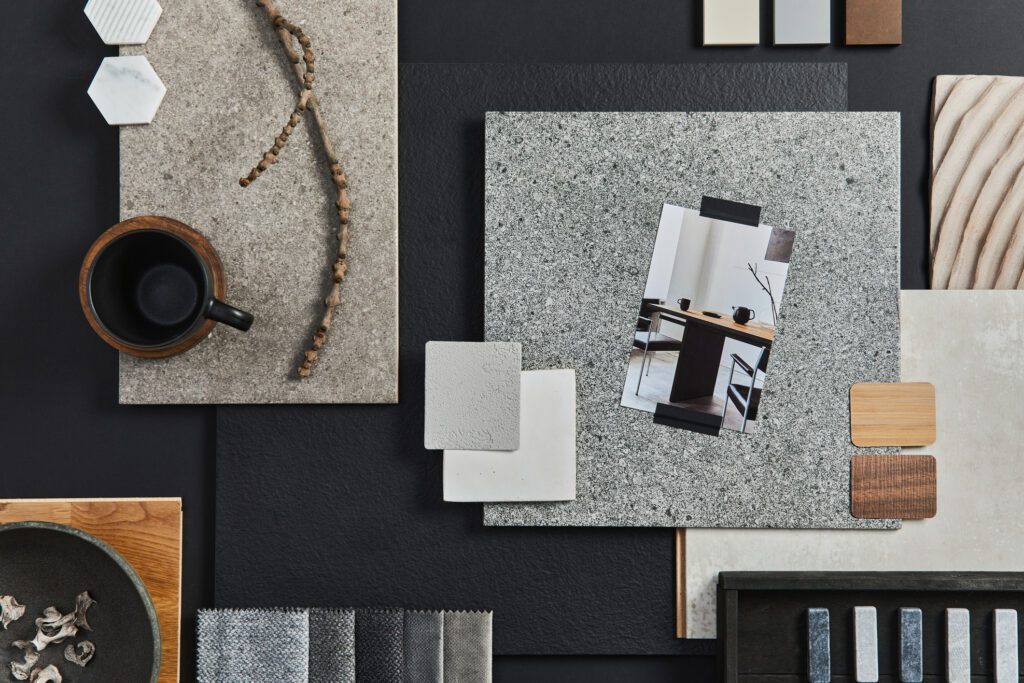 Dark and wooden textures and design objects flatlay